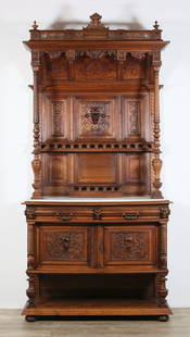 French Renaissance Revival Buffet Deux Corps: French Renaissance Revival tiered buffet or buffet deux corps. Early 20th century. White marble top, carved demon grotesques, two drawers and two doors. Key is included. Marble is broken in two pieces