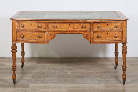 Victorian Tiger Maple Writing Desk: Victorian tiger maple writing desk. Late 19th century. Inset tooled green leather, five drawers, turned legs on later casters. Scratches, marks, wear and losses to leather. Heavy losses to wood on fro