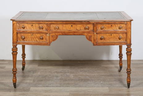 Victorian Tiger Maple Writing Desk: Victorian tiger maple writing desk. Late 19th century. Inset tooled green leather, five drawers, turned legs on later casters. Scratches, marks, wear and losses to leather. Heavy losses to wood on fro