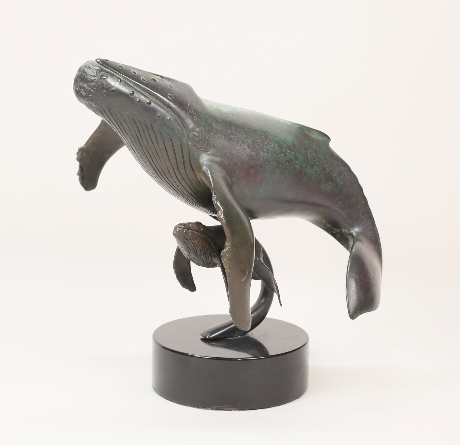 Dale Evers Patinated Bronze Whales: Dale Joseph Evers (American, 1955-). Patinated bronze sculpture whale with baby. Signed on the tail of the larger whale Dale Joseph Evers and numbered 9-100. On a marble base. 13 3/8"L x 12 3/8"H. Bro