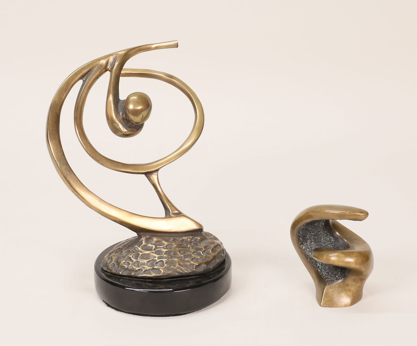 2 Bob Bennett Bronze Sculptures: Bob Bennett (American, California, 1928-2003). 2 abstract bronze sculptures. Perfect swing, signed, numbered illegibly and dated 1994, 6 1/2"H including base; Maestro, signed and numbered 503, 3"H.