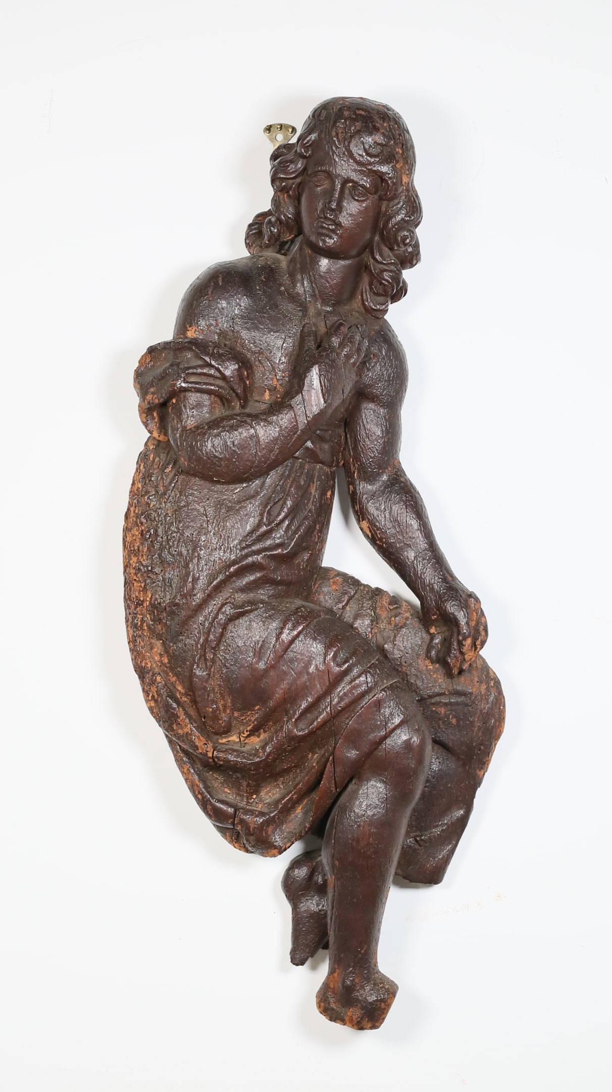 Carved Wood Figure of an Angel: Wood carved angel figure. Possibly from a ship or altar piece. 37 1/8"L x 15"W x 4 3/8"D. Chips and losses to wood throughout, one foot missing and one worn, finger missing from top hand, chips and lo