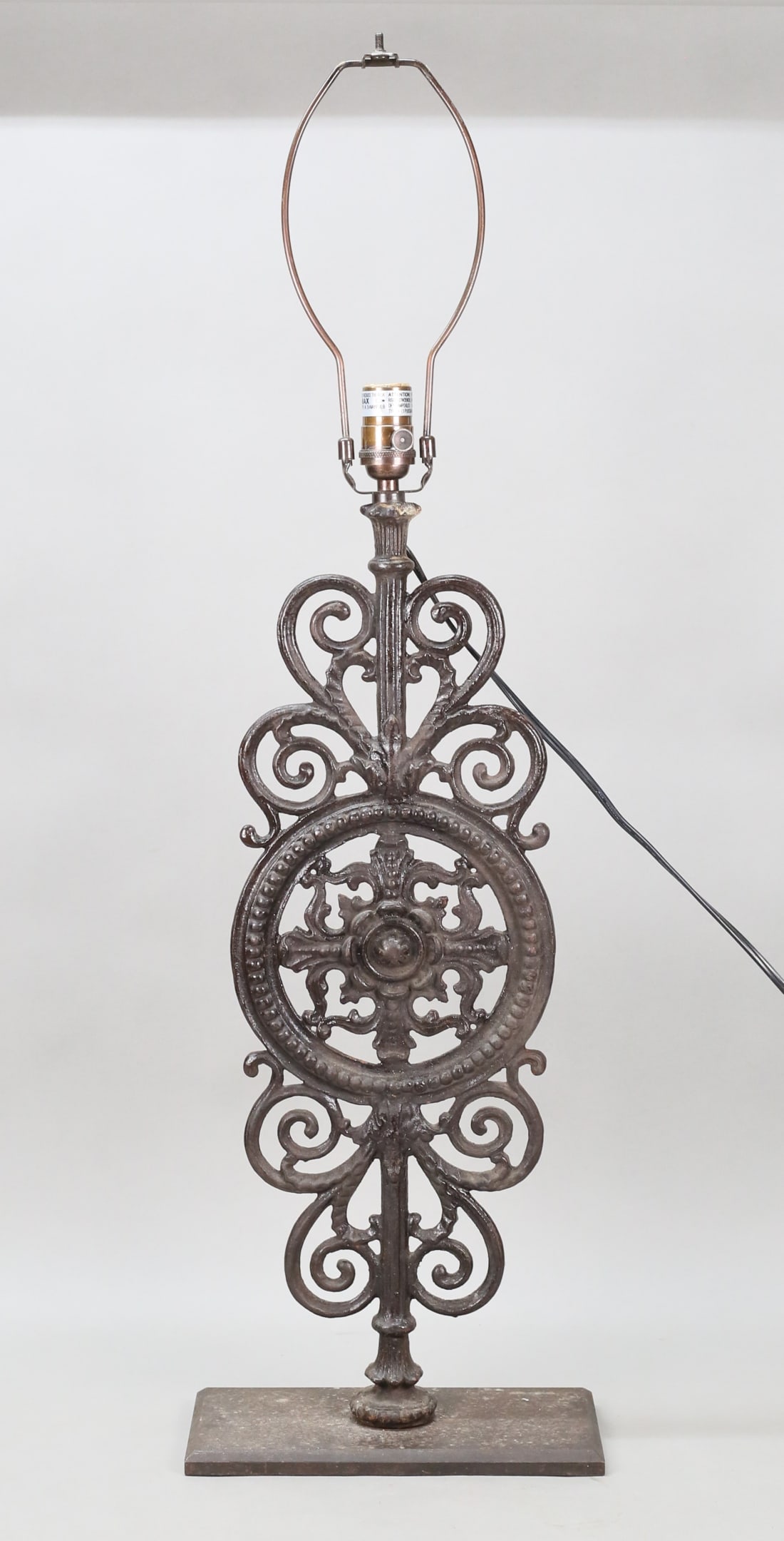 Restoration Hardware Iron Scroll Lamp: Restoration Hardware iron scroll form table lamp. 36 3/4"H to top of harp. Missing finial, some rusting and minor losses to patina.