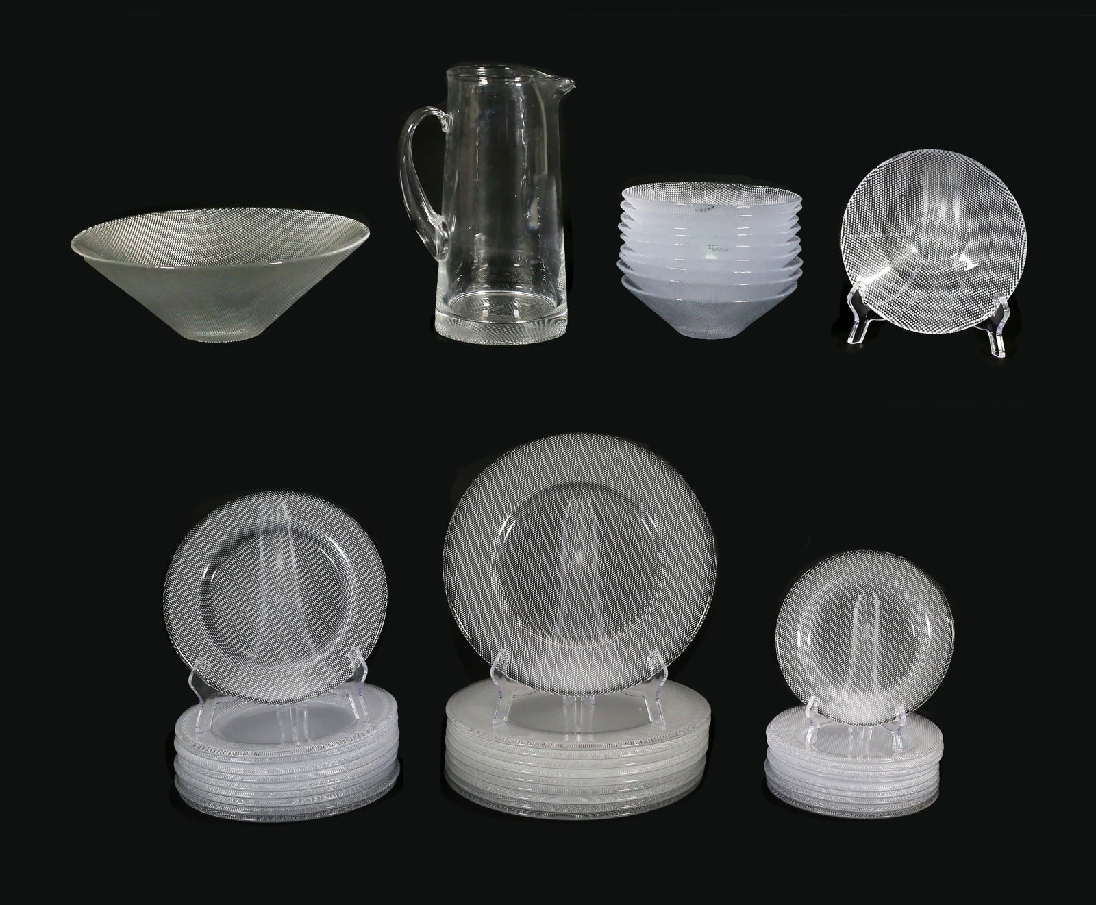42 Pieces Goran Warff Kosta Crystal Dinnerware: Goran Warff for Kosta Boda modern glass dinner service for 10. Crystal with textured undersides. 42 pieces: 10 service plates, 10 dinner plates, 10 salad plates, 10 bowls, pitcher, serving bowl. Pitch