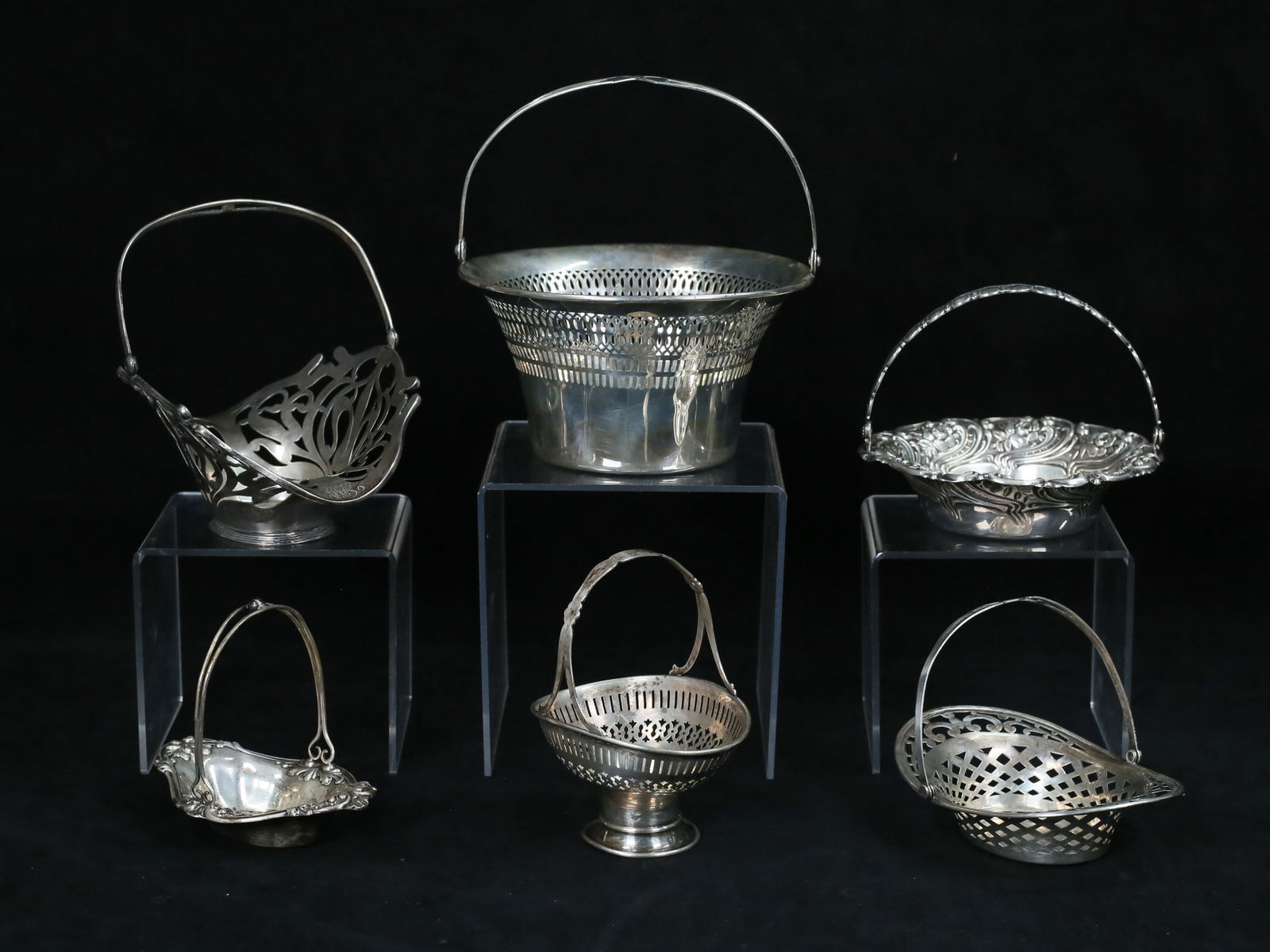 6 Sterling Baskets Gorham, Reed & Barton, Saart: 6 American sterling silver baskets. including Saart Brothers, Gorham, Reed & Barton, Woodside, Frank Smith for Bullard Bros. 4 pierced rims and bodies, Smith basket monogrammed. Saart basket 3 1/8"H x