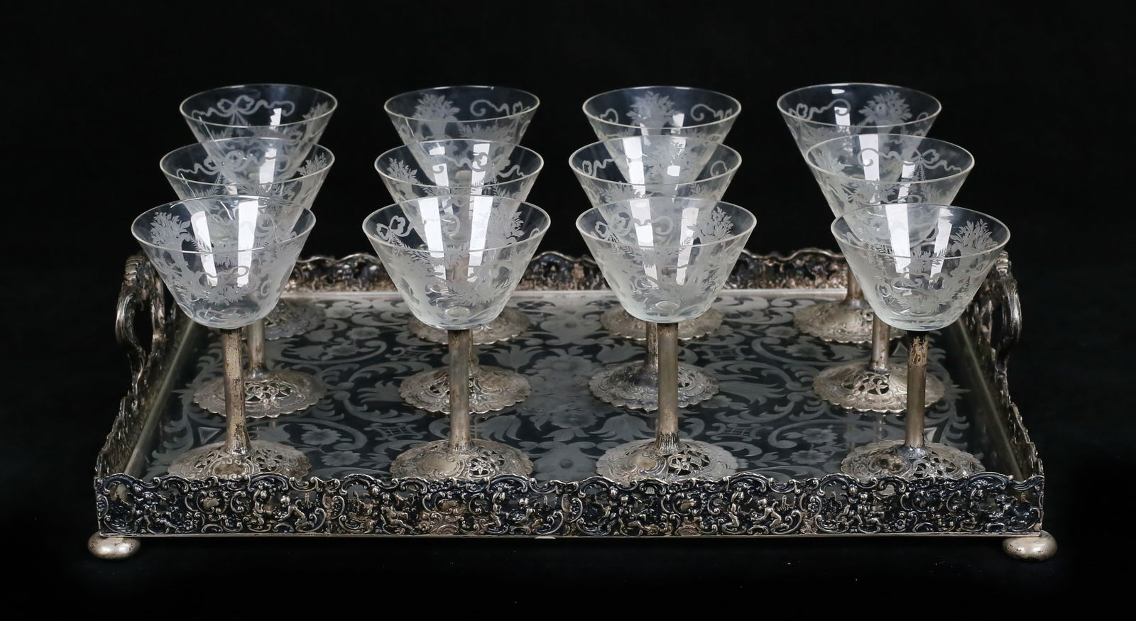 13 Piece 800 Silver & Etched Glass Cordial Set: 13 piece cordial set. 12 pieces stemware, hallmarked German 800 silver bases and stems, with etched glass bowls; with an associated etched glass tray with German 800 silver mounts. Cordials each 4 1/4