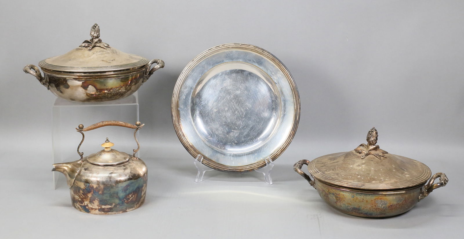 4 Pieces Silverplate Christofle & Barker Ellis: 4 pieces silverplate tableware. Pair of Christofle France covered vegetables, with figural foliate finials on the lids, each 6 1/4"H x 11 1/2"W including lids and handles; Christofle France plate, 10