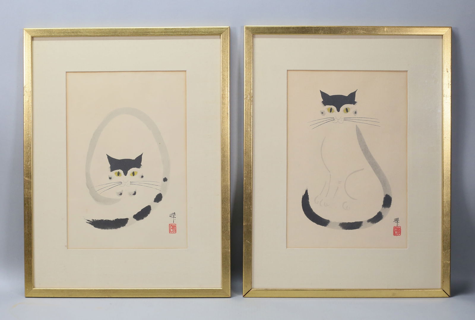 Pair of Japanese Ink Wash Paintings Cats: Pair of Japanese ink wash paintings of cats. Both signed in ink and with red seal lower right. Each 14 3/4" x 10" (with frames 22 5/8" x 17 1/4"). Some toning and discoloration to paper, discoloration