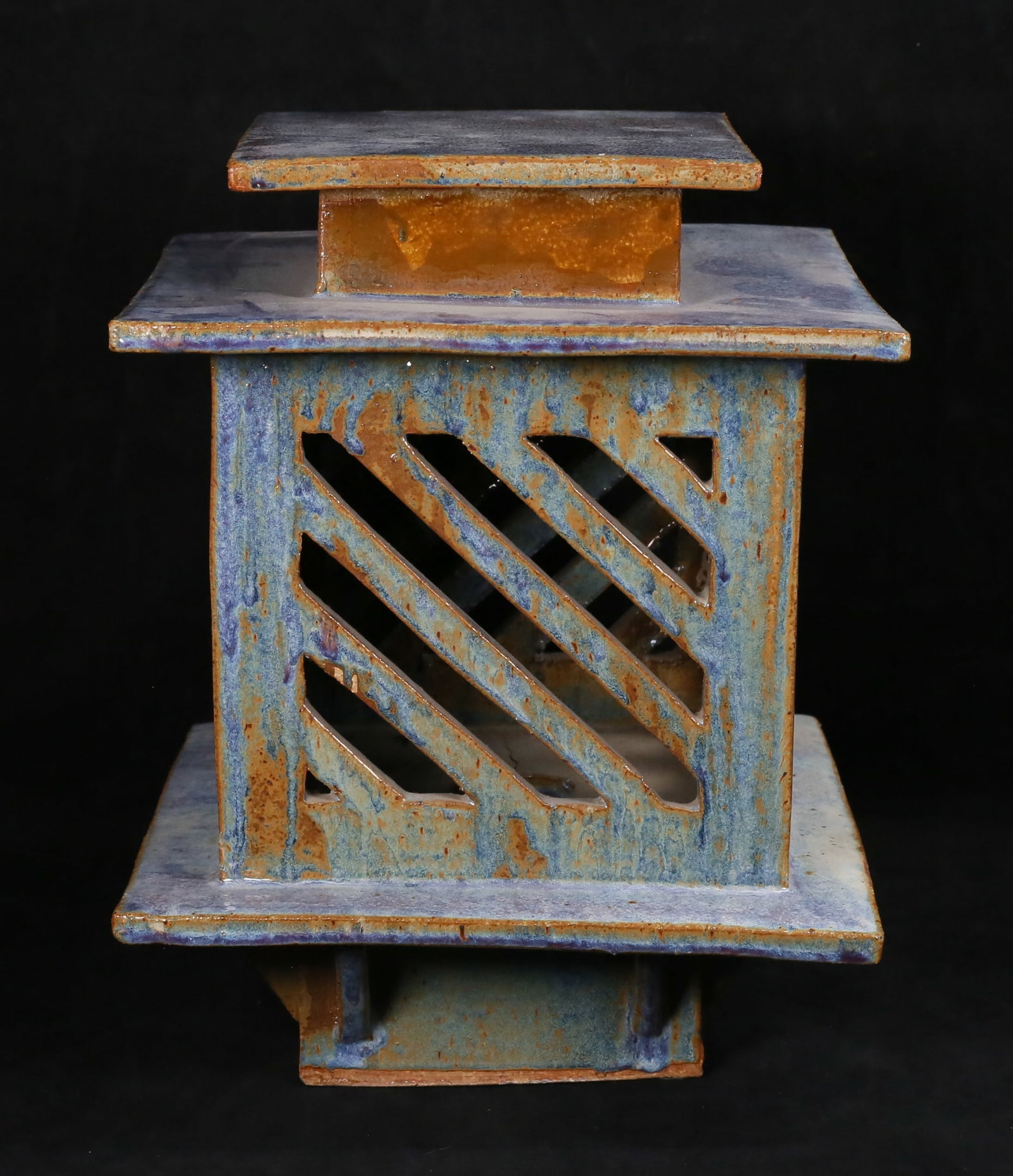 Japanese Style Pottery Lantern: Japanese style ceramic lantern. Unsigned. 11 7/8"W x 11 7/8"D x15"H. Firing crack to the underside, minor chip to the rim under the lid.