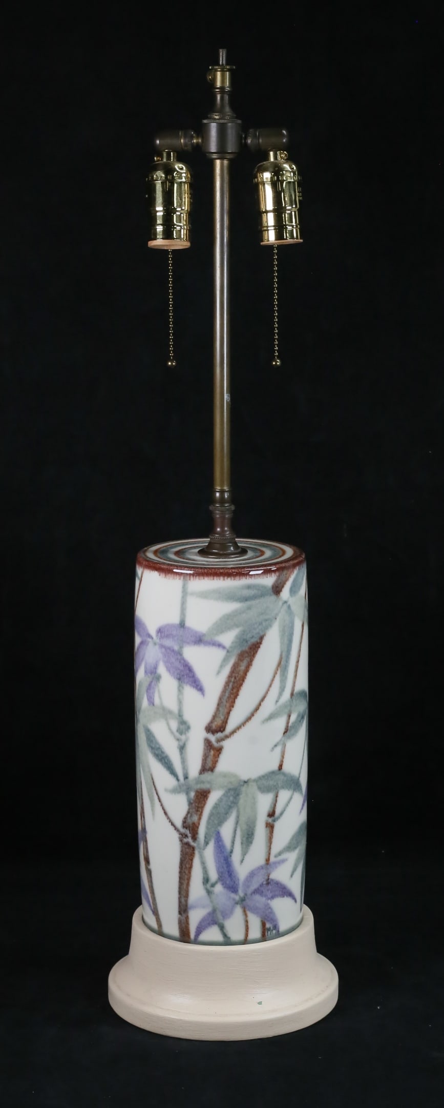 Margaret McDonald Rookwood Pottery Lamp: Margaret McDonald Rookwood pottery lamp. Bamboo motif, artist initialed MM above the base. 28"H including base and lamp fittings. Missing finial. Paint loss to wooden base, firing imperfection to the 