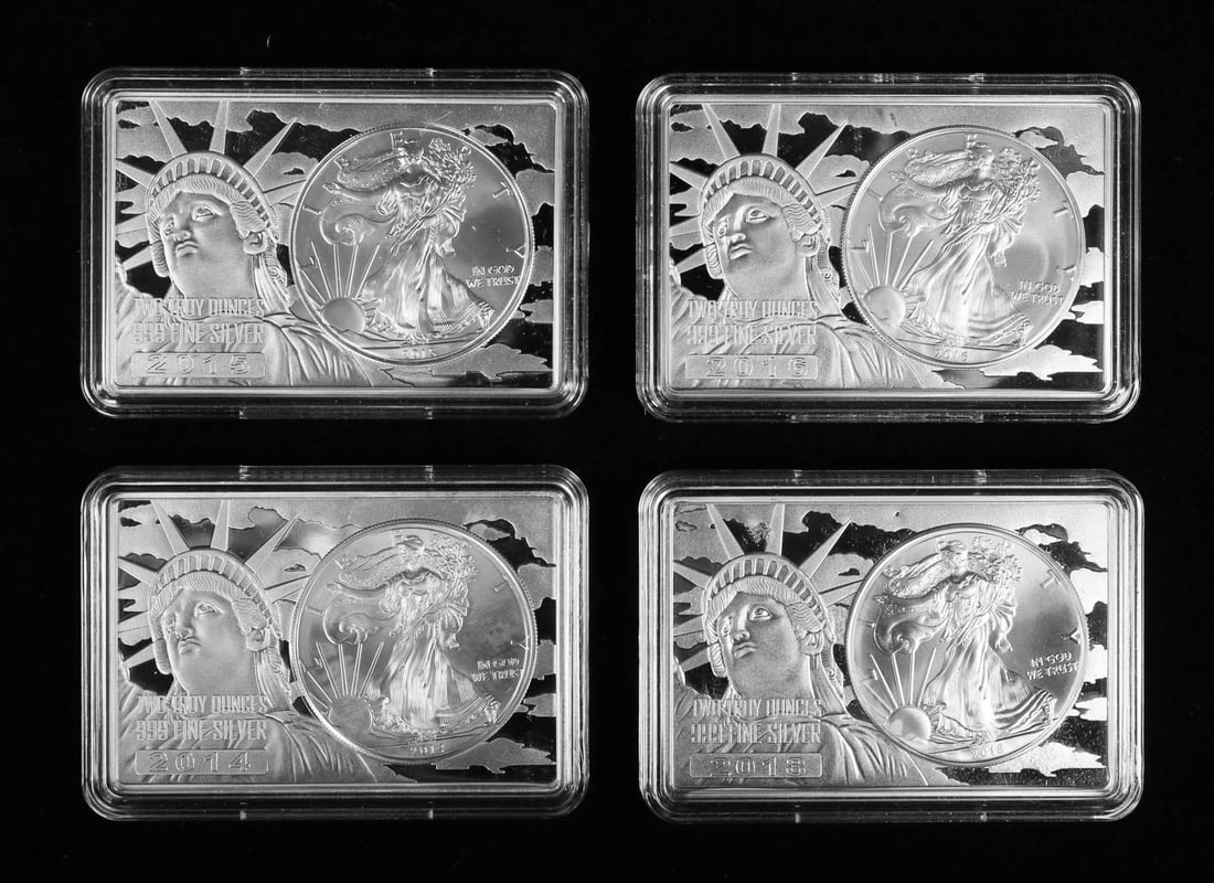 Silver Eagle Coins in 2 Oz Silver Bars: 2014, 2015, 2016 and 2018 Silver Eagle 1 oz. coins encased in Statue of Liberty 2 oz. bars .999 silver. 12 oz total silver.