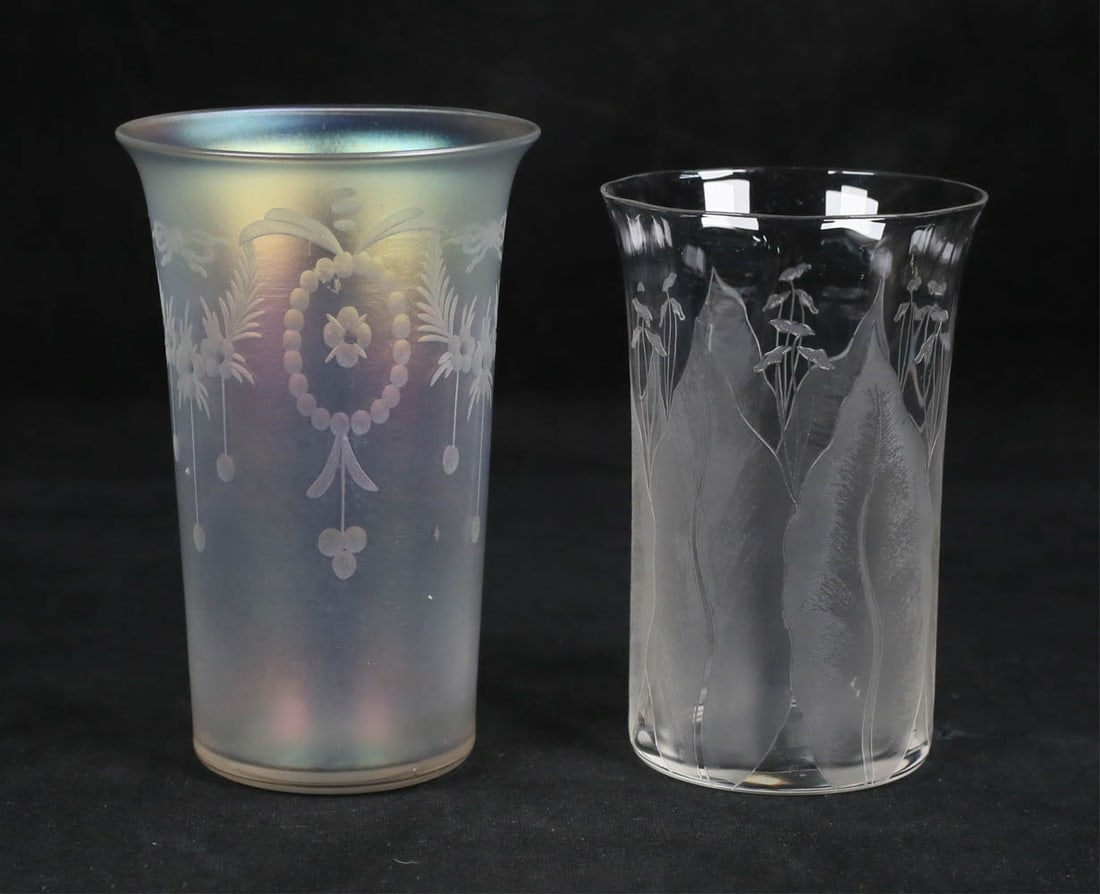 2 Etched Glass Tumblers 1 Steuben Verre de Soie: 2 etched glass tumblers. Steuben Hawkes verre de soie iridescent glass with etched wreath decoration, etched Hawkes on the underside, 4 3/4"H; etched with leaf decoration, unsigned, possibly Steuben,