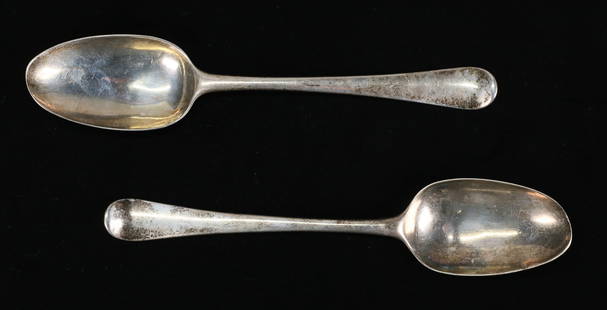 Pair Hester Bateman English Sterling Spoons 1776: Pair of hallmarked 18th century English sterling silver serving spoons. Hester Bateman HB maker's mark, London, circa 1776. Each 8 1/4"L. 158.1 grams total. Tarnished, one with scratches to the