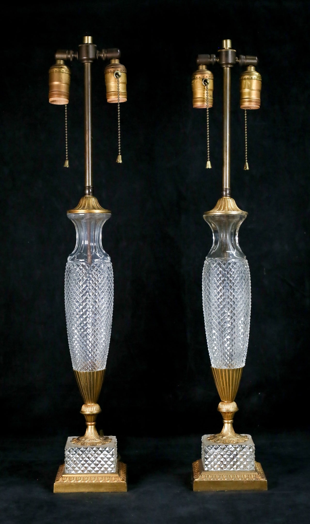 Pair of French Crystal & Gilt Metal Lamps: Pair of French cut crystal and gilt metal lamps. Attributed to Seiler Cristal. Each 27 3/4"H to top of lamp fittings. Both unsigned. Both missing finials. Some losses to patina on gilt metal mounts an