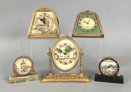 5 Desk Clocks Landscape Scenes Waltham, Doxa: 5 scenic brass and gilt bronze desk / boudoir clocks. 2 Waltham 8 day clocks with hand painted landscape scenes, 1 with enamel decoration; Doxa with church in landscape; travel clock with landscape sc