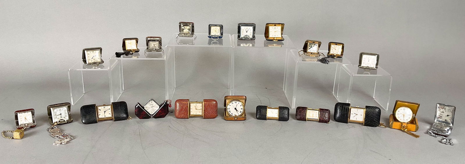 20 Purse Watches & Travel Clocks Movado, Mersmann: Lot of 20 travel clocks and purse watches, including Lucerne, Edding in 12k gold filled case, Concord, Bucherer, 2 Movado, Seeland, Leader, Geneva, WB, Lafayette, Mersmann, Marshall, Turler with sterl
