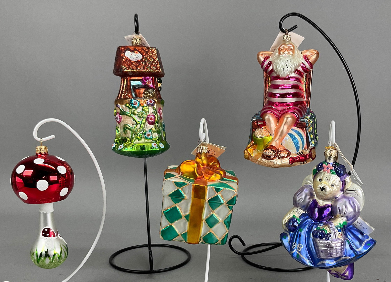 5 Radko Summer Ornaments Most with Tags: 5 Radko Summer Ornaments Most with Tags. Includes Muffy Plum Fairy, Summertime Santa, Well Wishes - 7" - Longest, Red Mushroom - No Tag, Pretty Paper -- 5" - Shortest. Wear and scratches to bathing su