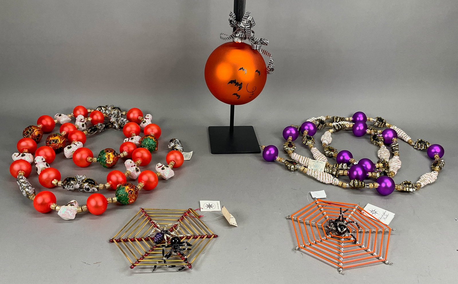 6 Halloween Ornaments & Garland - Radko/Fraga: 6 Halloween Ornaments & Garland - Radko/Fraga - Some with Tags. Includes Radko Web Sight #01-0925-0, Christmas Spider #922122, Black Beaded Spider - 3" - Shortest, Fraga Purple Mummy Spider Garland - 