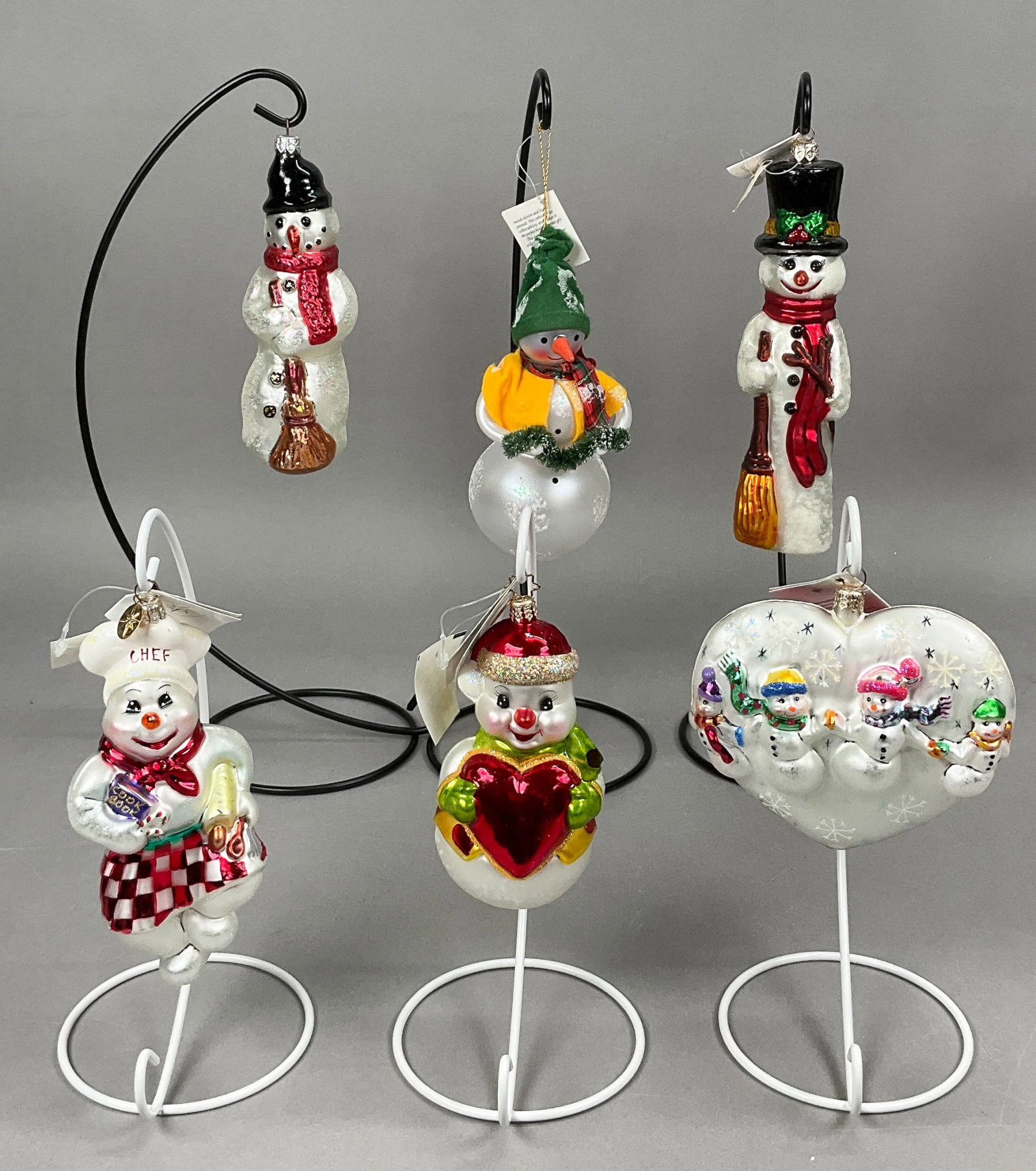 6 Radko Snowmen Christmas Ornaments Most w/ Tags: 6 Radko Snowmen Christmas Ornaments Most with Tags. Includes Holly Jolly, Frosty's Bake n Shake #00-039-0, Frost in Love, Frosty Snow Stroll, Slim Chuckles #98-195-0 -- 9" - longest & Warm Hearted Won