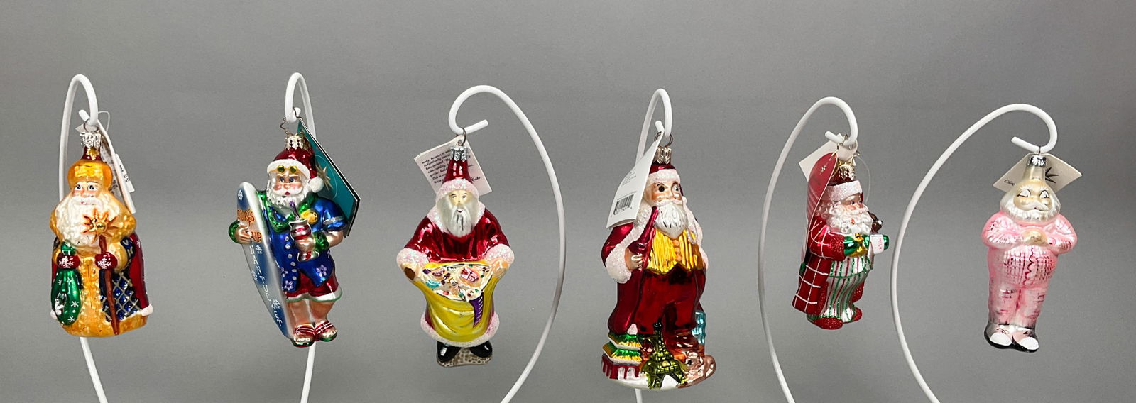 6 Radko Santa Christmas Ornaments with Tags: 6 Radko Santa Christmas Ornaments with Tags. Includes Bag Full of Toys, Nantucket Surfside Santa, Sleepytime Santa 1991, Petite St. Petersburg #00-216-0, Santa for All Nations by Saks Fifth Ave (Radko