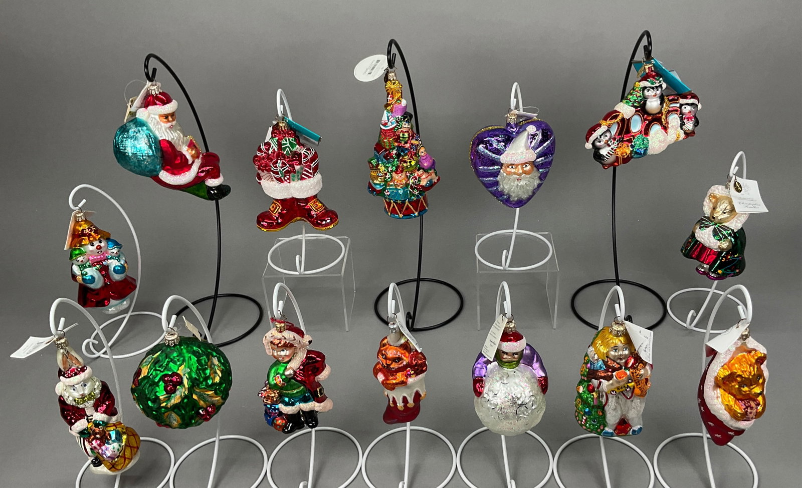 14 Radko Christmas Ornaments Santa Penguins Bear: 14 Radko Christmas Ornaments Most w/ Tags. Includes All Ready to Go #972380, Santa Heart #30887-950811, Purrfect Present - Has some white marks on face, Child Building a Snowman, Presents to Boot #101