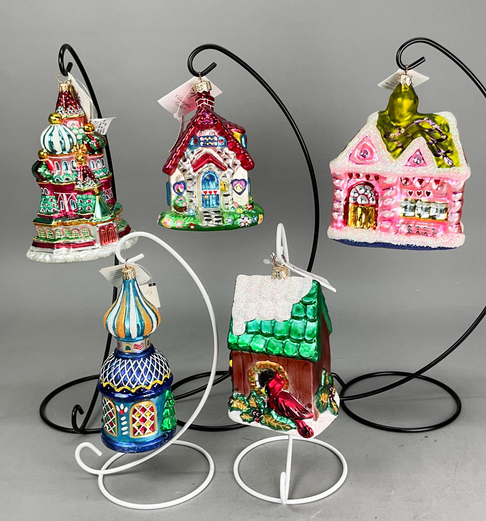 5 Radko Houses Christmas Ornaments Snow Covered: 5 Radko Houses Christmas Ornaments with Tags. Includes Honeymoon Hideaway #01-0267-0, Sunday Brunch Nibble Nibble Limited Edition - #5,692/7,500, Russian Chapel #98-136-0, Merry Portrait #1011303 - 7"