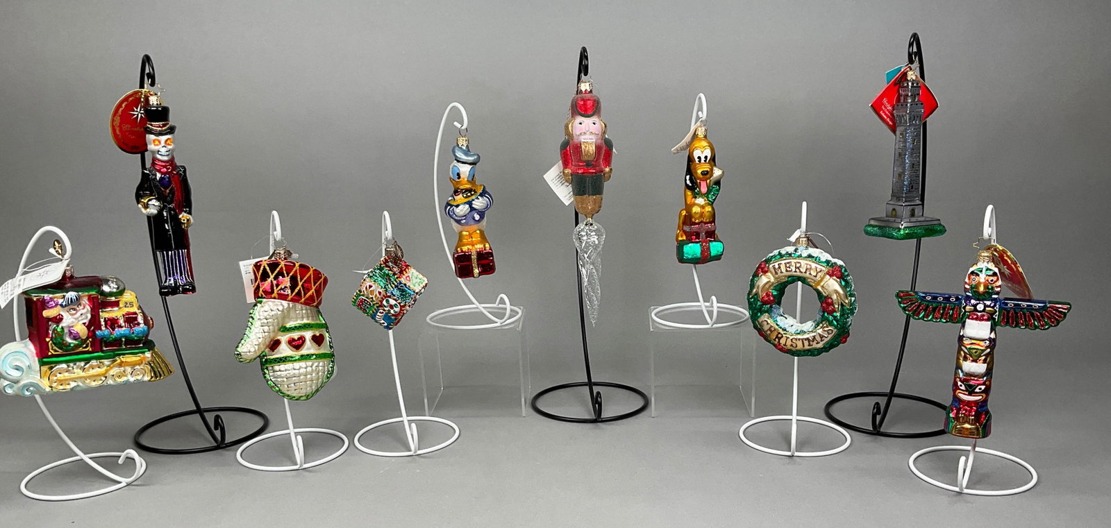 10 Christmas Ornaments Some Pluto - Radko, EC: 10 Christmas Ornaments Some w/ Tags - Radko, Eric Cortina, Includes Radko North Pole Junction #00-147-0, Out of Time #1017801 - Retired, Northwest Dreams #1017985 - Retired, Provincetown #3011879, Noe