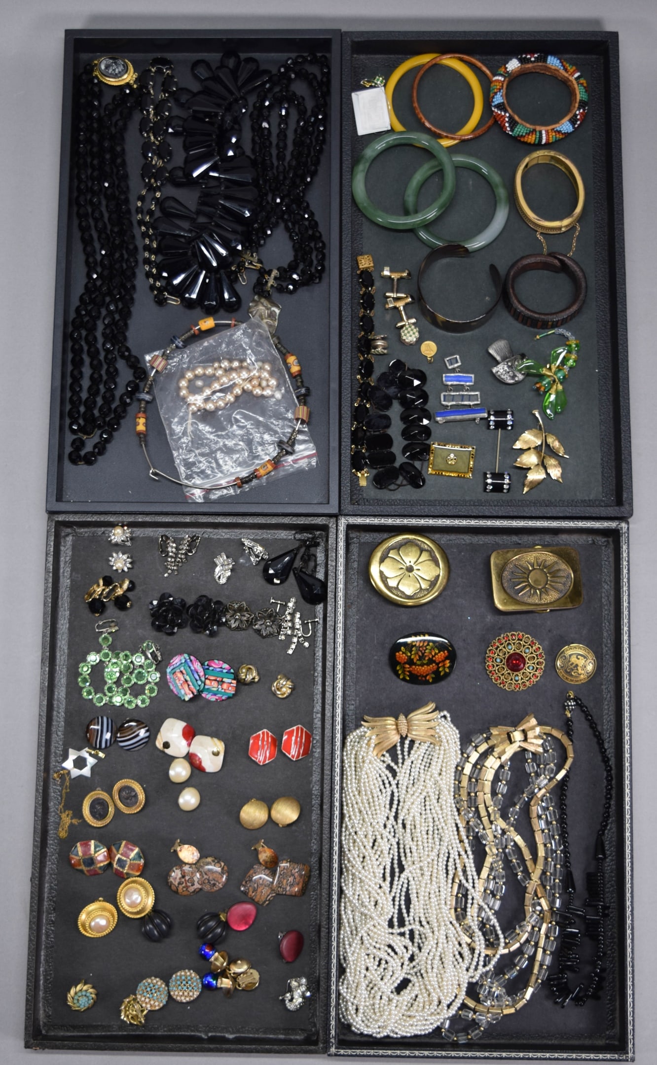 Lot of Vintage Costume Jewelry: Lot of vintage costume jewelry including necklaces, bracelets, brooches, earrings, Marvella multi-strand faux pearl necklace, Napier multi-strand glass bead and gone tone necklace, Napier ear clips, C