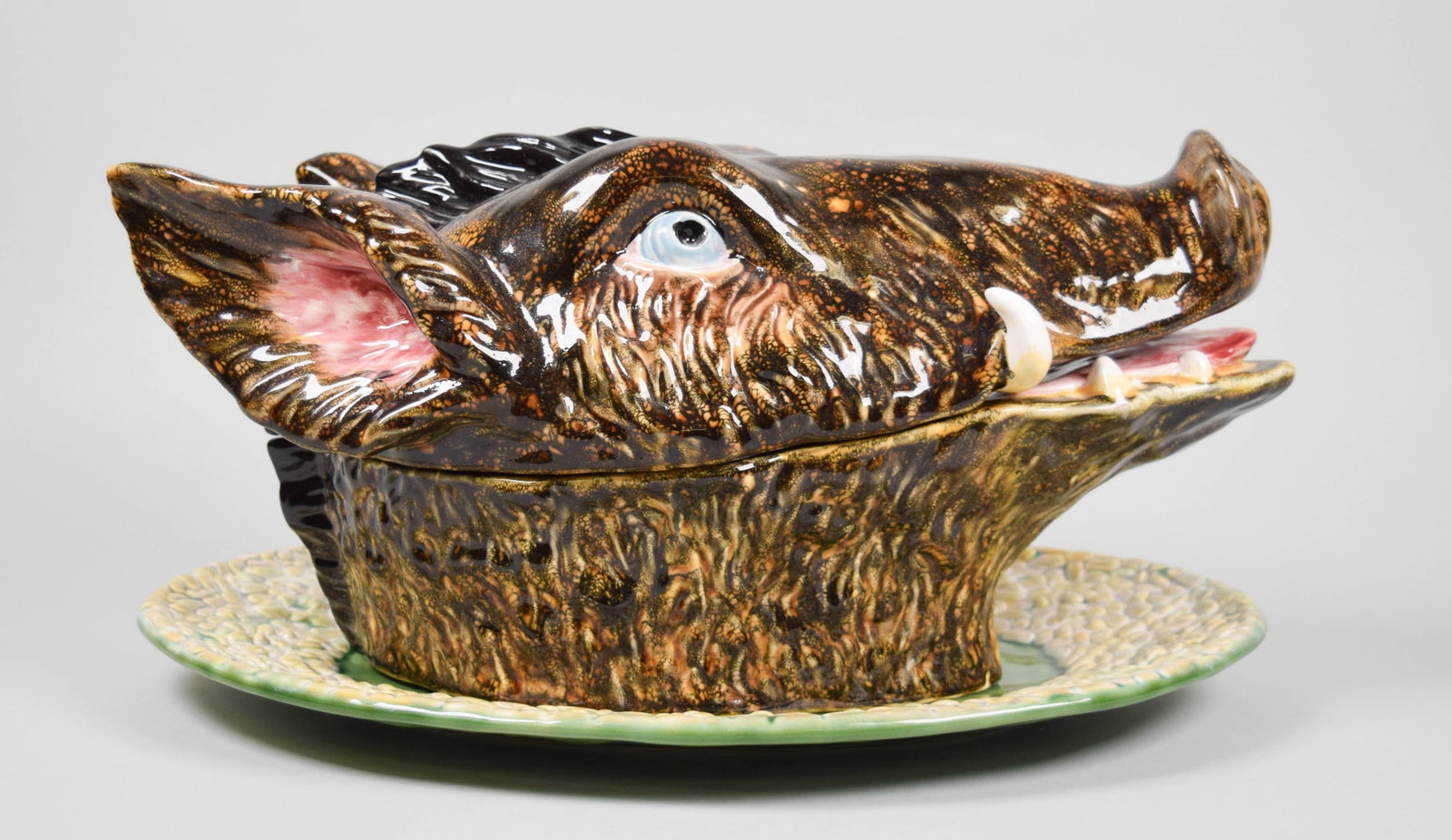 Bordallo Pinheiro Majolica Boar's Head Tureen: Bordallo Pinheiro majolica pottery figural boar head tureen, with underplate and ladle. Marked on the underside of the tureen and underplate Bordallo Pinheiro Made in Portugal. Tureen 16"L x 8"H, unde