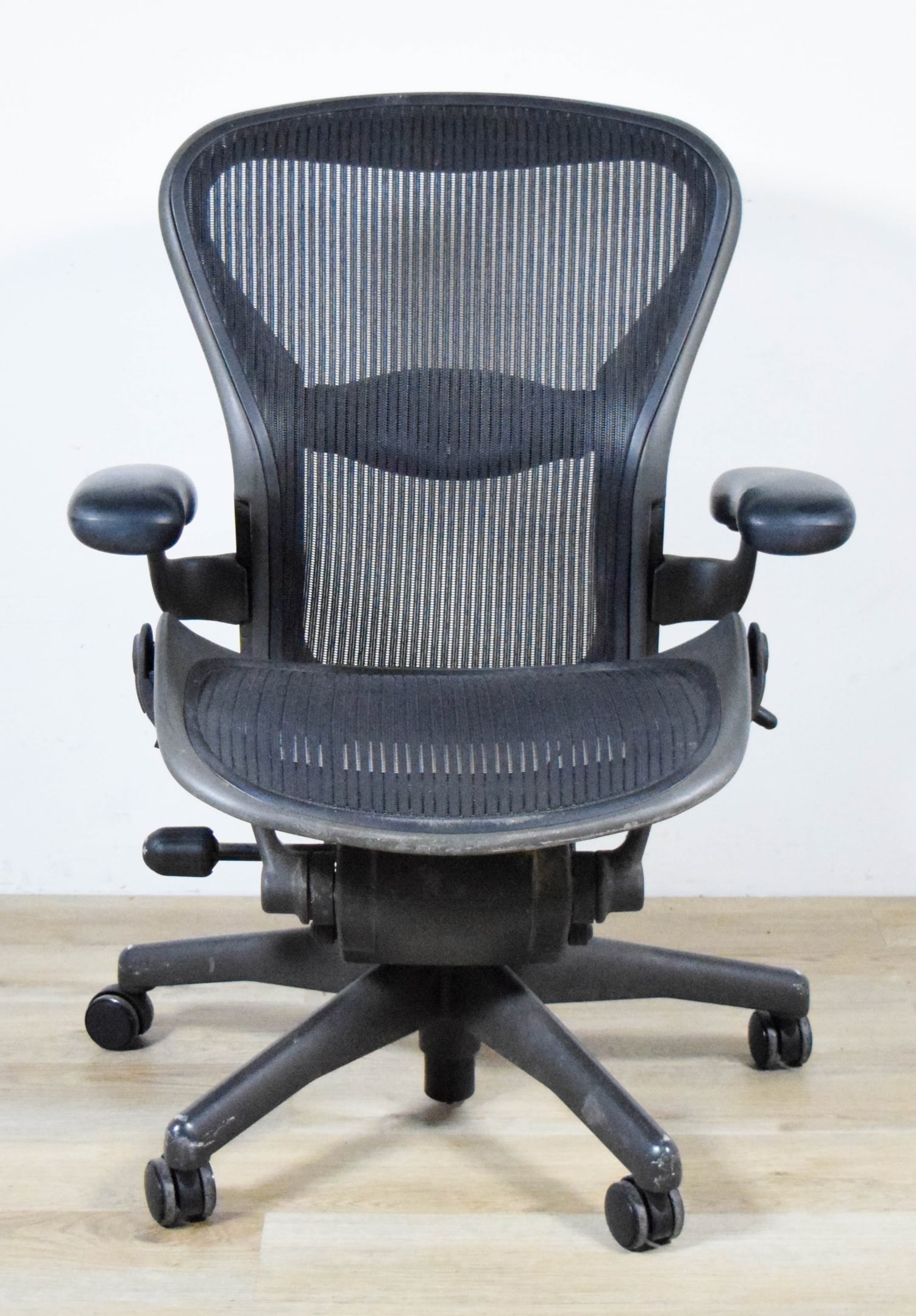 Herman Miller Aeron Office Chair Size B: Herman Miller Aeron office chair. Size B. 26"W x 26"D x 35 1/2"H as photographed. Lever for height adjustment broken off, height does not adjust; tilt lever missing and tilt does not adjust; lumbar su
