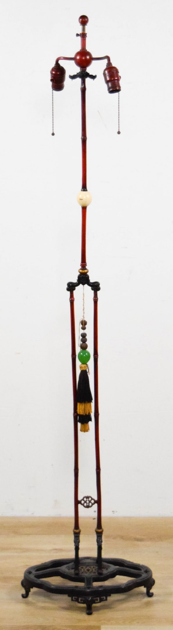 Chinoiserie Floor Lamp Faux Bamboo: Chinoiserie floor lamp, red painted iron, faux bamboo form, bone font, hardstone and wood carved beads. Unsigned. With silk shade with Chinoiserie cherry blossom motif. Lamp base 13 3/4"W not includin