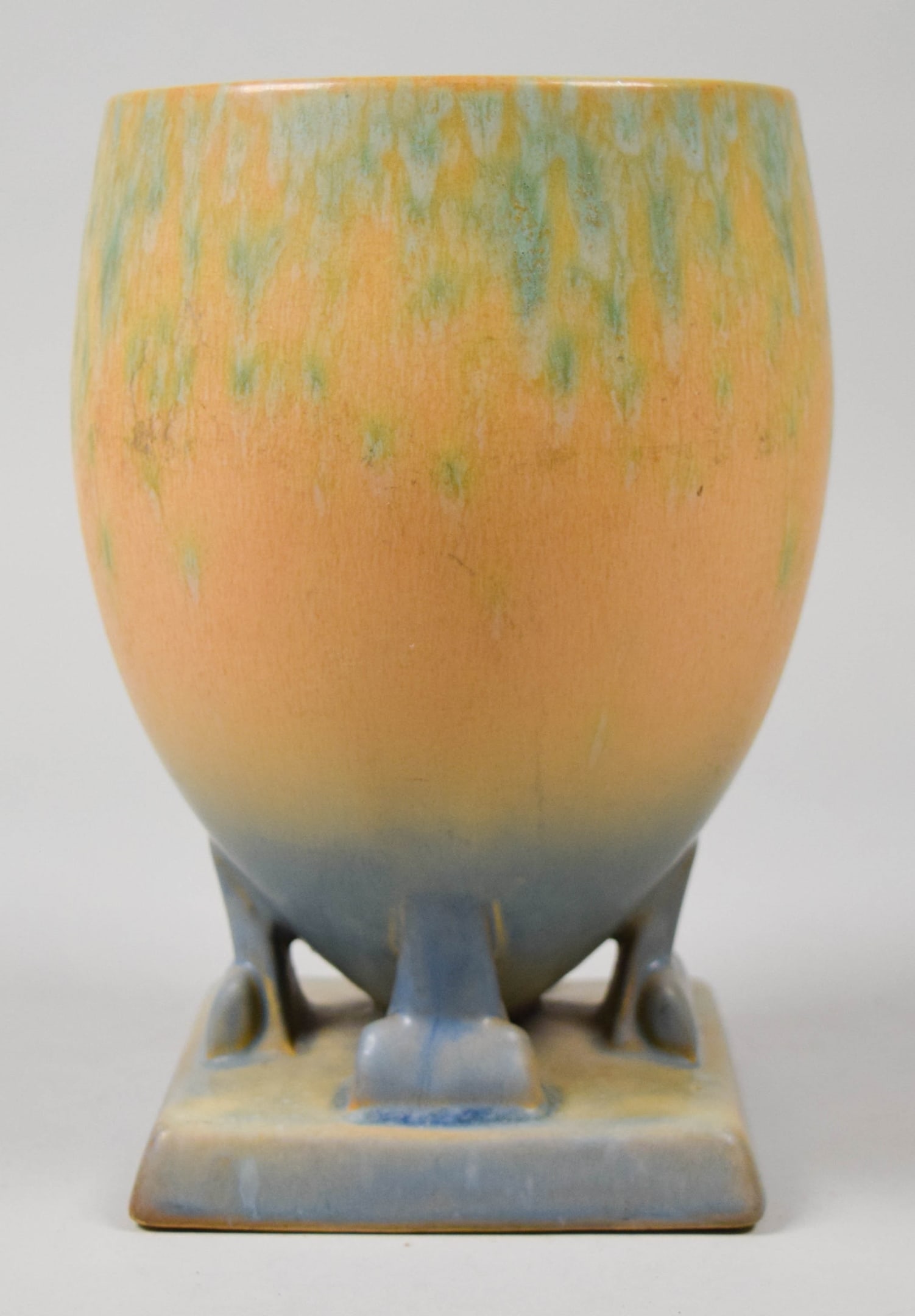 Roseville Pottery Futura Vase Ostrich Egg: Roseville Pottery Futura "Ostrich Egg" vase. Unsigned. 7 1/2"H. Scratches and crazing throughout, firing crack to one leg.Provenance: The Estate of Dr. Benard Dreyer. Dr. Benard Dreyer, past president