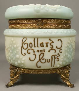 Wave Crest Collars & Cuffs Box: Wavecrest Collars & Cuffs hinged lidded dresser box. Opaque glass, floral decoration and gilt painted lettering, gilt metal mounts. Unmarked. 7 1/4"H x 8 1/2"W including feet.