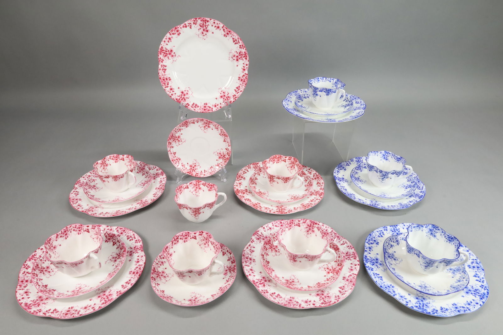 26 Pieces Shelley Bone China Dainty Pink & Blue: 26 pieces Shelley English bone china. 17 pieces Dainty Pink pattern: 5 luncheon plates, 6 saucers, 6 cups; 9 pieces Dainty Blue pattern: 3 luncheon plates, 3 cups and 3 saucers. Luncheon plates 8"-dia