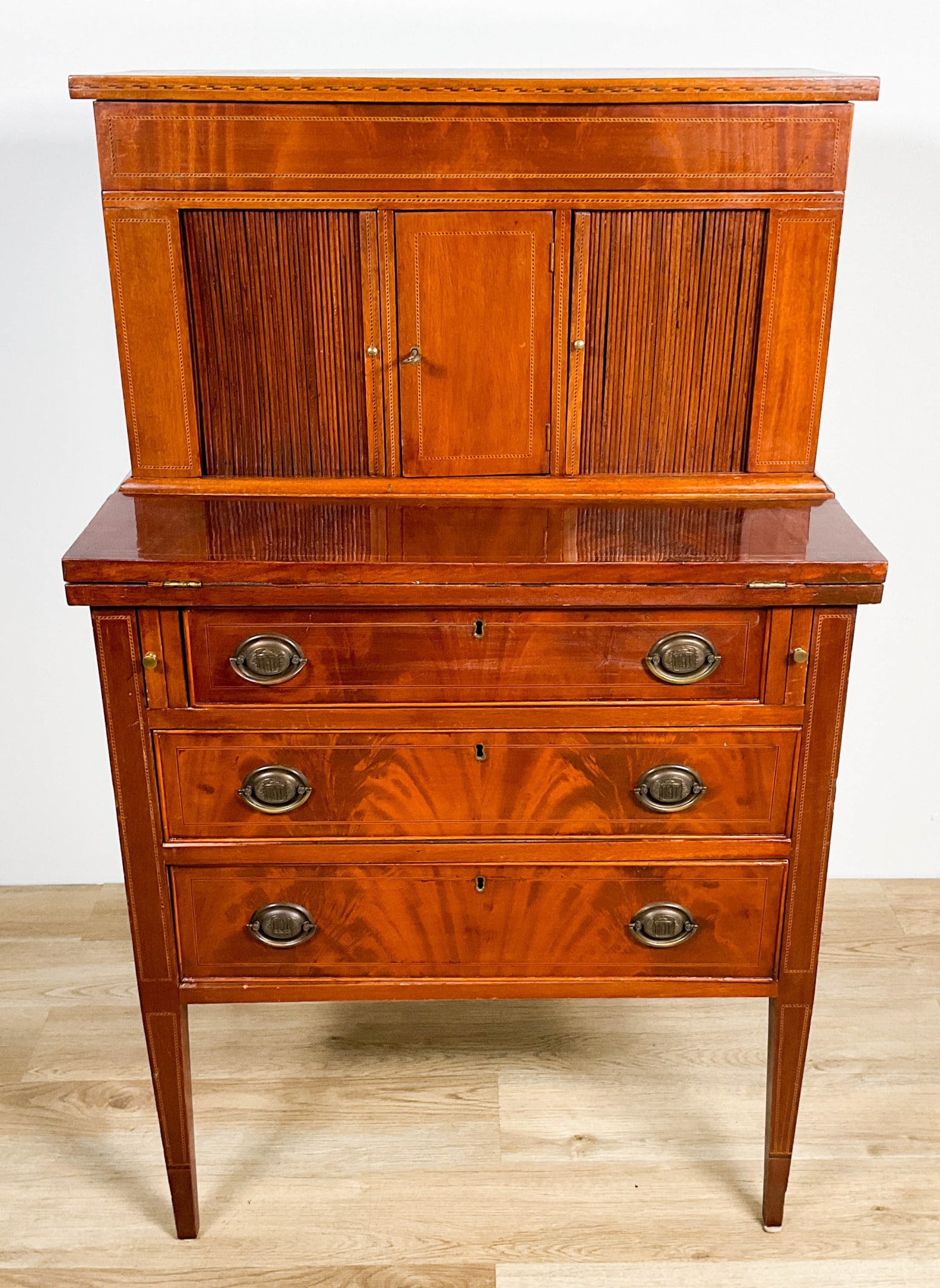 Ladies Writing Desk With Tambour Doors: Ladies writing desk with tambour doors. Losses, scratches, rubs and dents throughout. 46 1/2" Tall x 28 1/2" Wide x 18 1/4" Deep (closed) 26" (open)