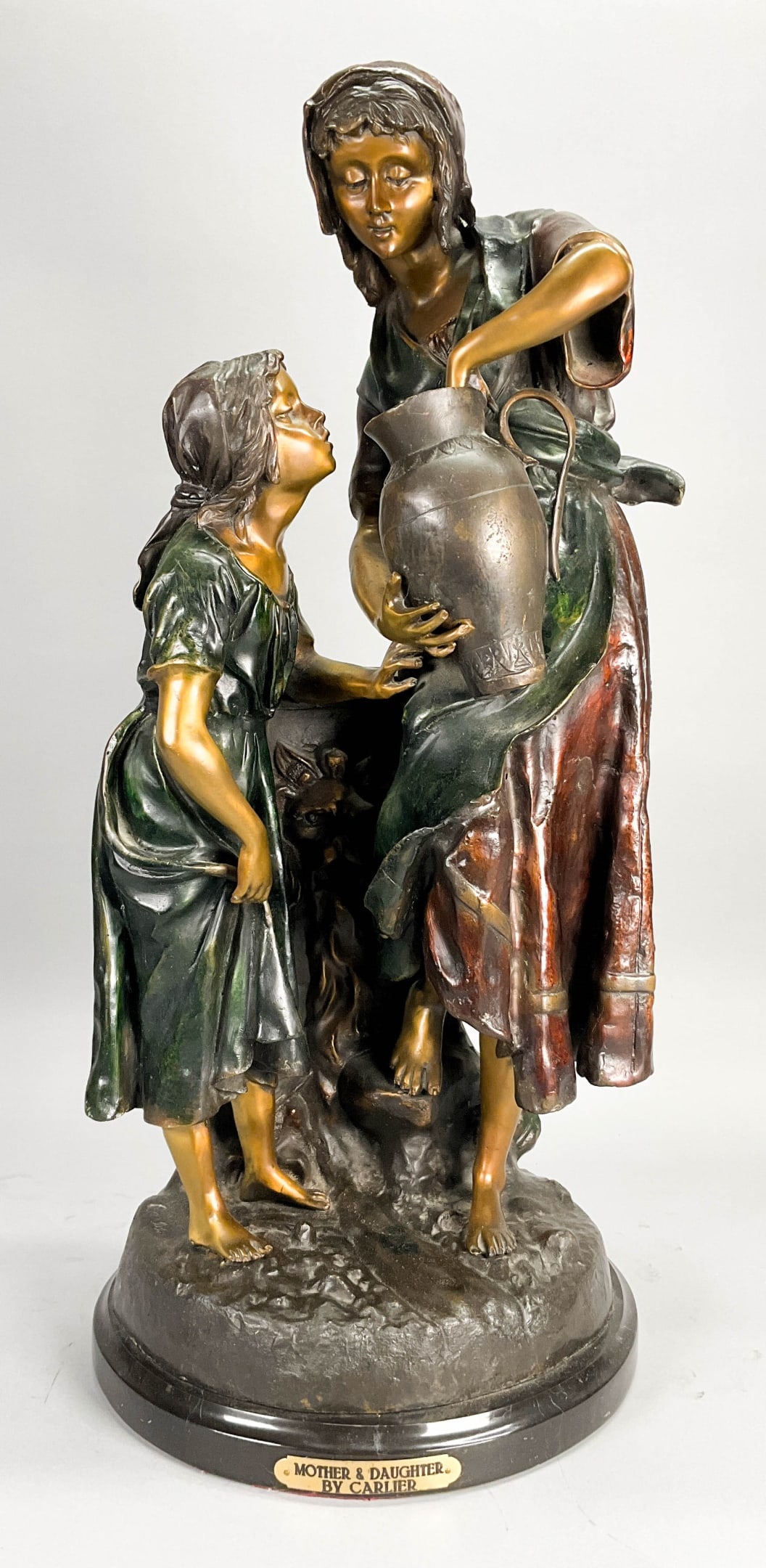 Bronze Of Woman And Child After Emile Carlier: Patianted bronze of woman and child after Emile Joseph Nestor Carlier (French, 1849-1927). Signed "Carlier" on back of base. 26 1/2" Tall x 13 1/2" Diameter.