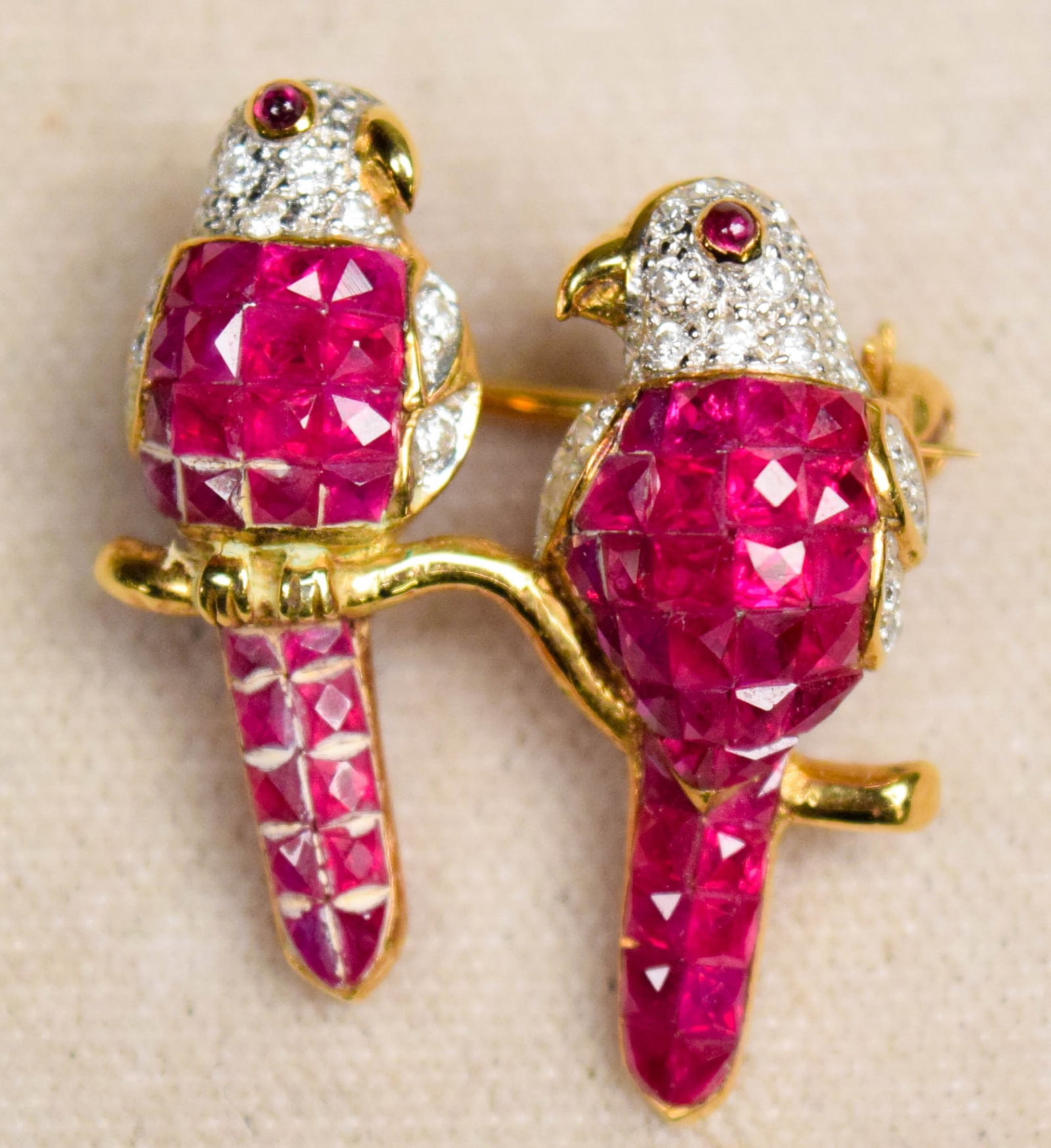 Ruby And Diamond 18 K Gold Lovebird Brooch: Lovebird brooch with rubies and diamonds mounted in 18K gold. Marked "750". 1" Tall x 3/4" Wide 4.7 grams total weight.