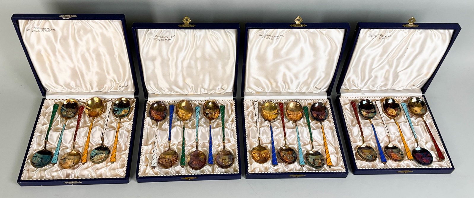 24 Ela Denmark Sterling Enamel Demitasse Spoons: 24 Ela Denmark sterling enamel demitasse spoons. Four separate cases each with six spoons. 593.3 grams total. Each marked "Ela Sterling Denmark". Tarnish and some scratches. 5 1/4" long.