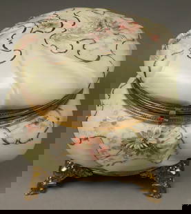 Wave Crest Footed Dresser Box: Wavecrest hinged lidded footed dresser box. Opaque glass, floral decoration, gilt metal mounts. Unmarked. 71/2"W x 6 5/8"H. Lid does not close flush, no lining, adhesive residue to interior around bas