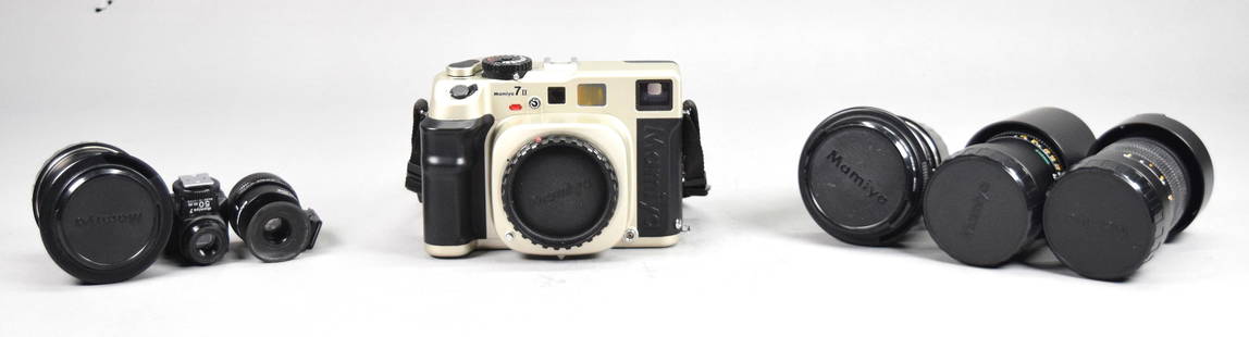 Mamiya 7II Medium Format Camera With 4 Lenses: Mamiya 7 II medium format camera and lenses. Camera body, serial no. SD1137, with strap and instruction manuals. With 4 Mamiya lenses: 1:4 80mm, 1:4.5 50mm, 1:4.5 150mm, 1:8 210mm; and 2 viewfinders: