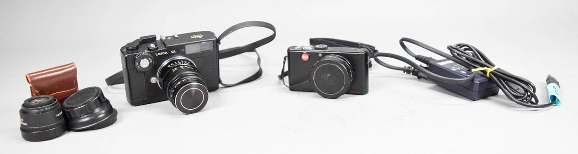 2 Leica Cameras CL & D-Lux 3 Digital, Focotar Lens: 2 Leica cameras. Leitz Leica CL, with Elmar-C 1:4/90 lens, camera serial no. 1331727, c.1973-74, with Leica Meter cell in leather case, camera 4 3/4"L; Leica D-Lux 3 digital camera, serial no. 3167593