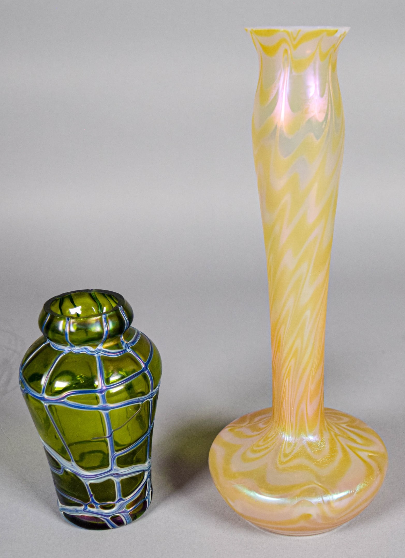 2 Loetz & Kralik Style Vases: 2 Loetz style art glass vases. Larger 10 1/2"H; smaller Kralik or Pallme Konig style, 5 1/8"H. Both unsigned. Larger with chips to the rim.