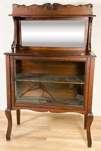 Victorian Mirror Top Display Case On Legs: Victorian mirror top display case on legs. With one shelf. Blemishes in mirror. Scratches, dents, nicks and loses throughout wood. 69" Tall x 44 1/2" Wide x 18" Deep