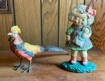 2 Cast Iron Door Stops - Bird and Doll