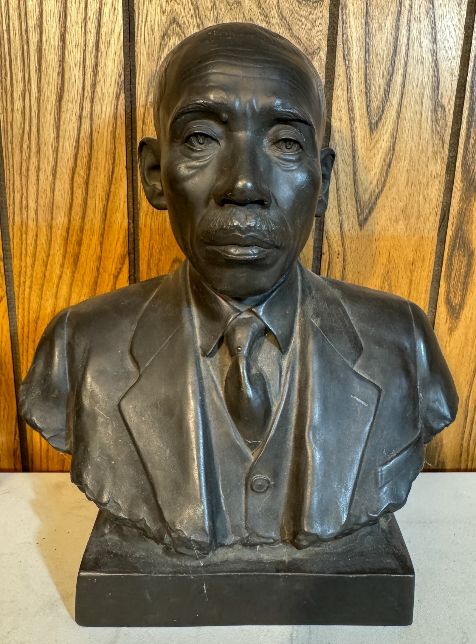 White Metal Bust Of A Chinese Gentleman: White metal bust of a Chinese gentleman with writing stamped on the back. Wear throughout. 13.75" h.