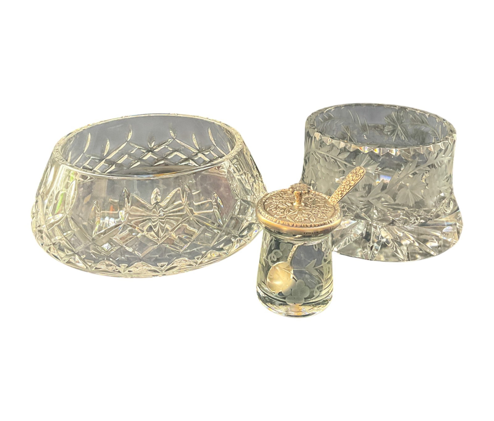 3 Crystal Tableware Incl. Waterford: Three crystal tableware items including one Waterford serving bowl in Lismore pattern. One crystal wine bottle coaster with grape motif signed "B. Healy" on base. Small lidded condiment jar with sterl