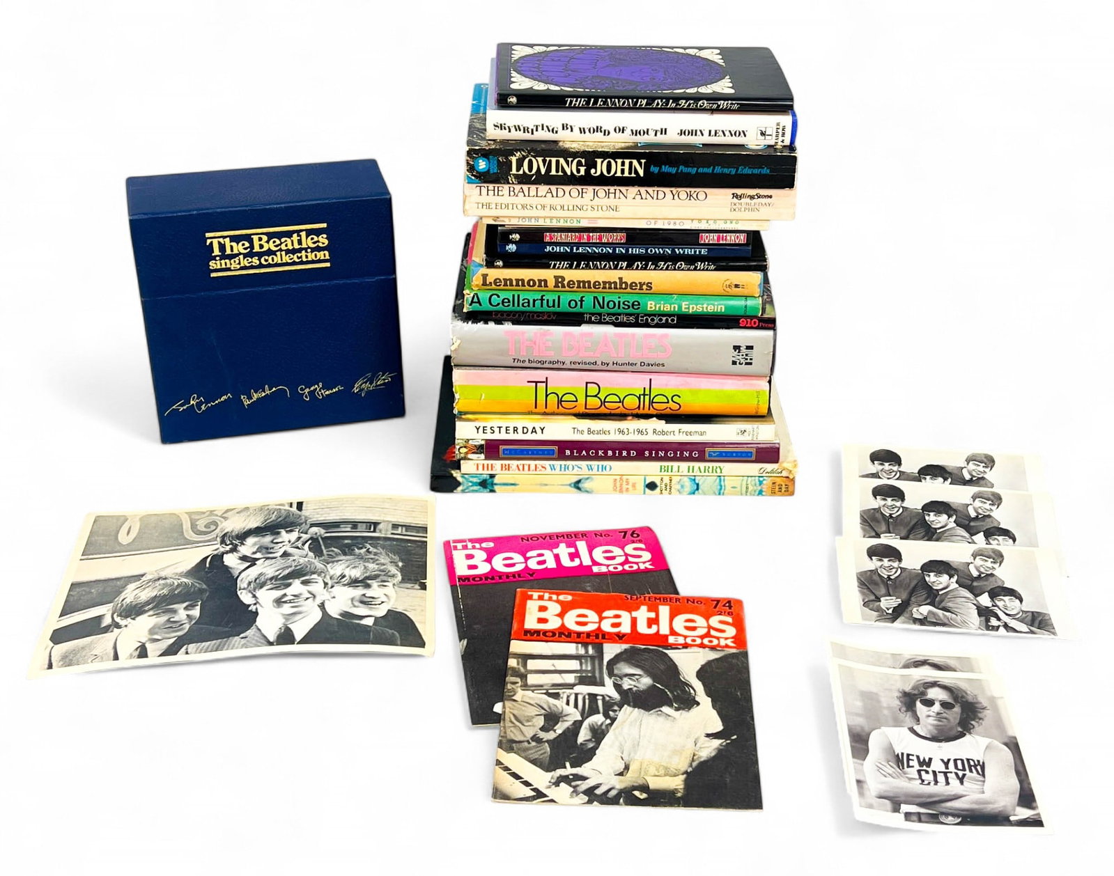 Group of Beatles Books, 45s, Photos: Group of Beatles items, including 17 books, postcards, photo, 45s. Books including The Lennon Play: In His Own Write, Skywriting by Word of Mouth, Loving John, The Ballad of John and Yoko, Lennon Reme