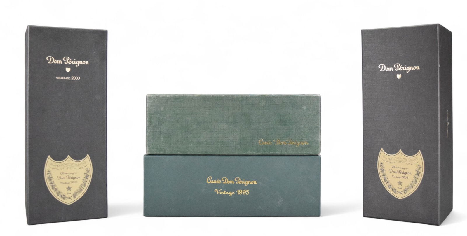 4 Bottles Vintage Dom Perignon In Boxes: 4 bottles vintage Dom Perignon in boxes. 1973, light leaking around top and stain to inside of box. 1995, sealed. 2003 and 2006, with paperwork, the 2006 box is tearing at the top right. These were no