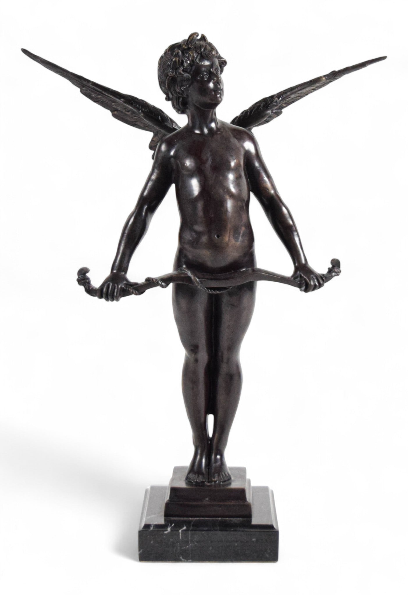 After Auguste Moreau Bronze Cupid Vici: After Auguste Moreau (French, 1834-1917). Bronze sculpture of Cupid with bow, Vici. Unsigned. On marble base. 21 1/4"H. White residue in the feathers of the wings and Cupid's hair.