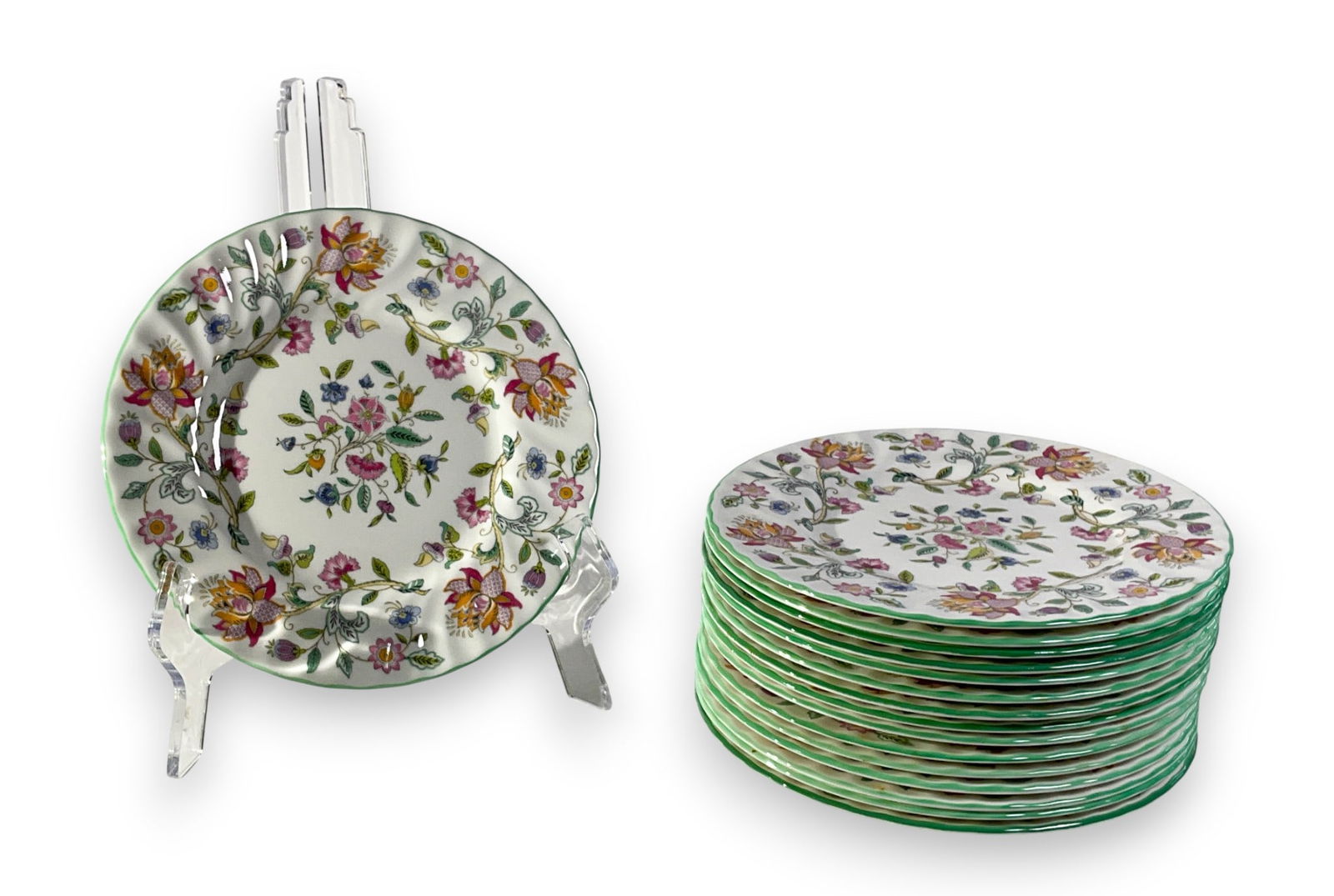 16 Minton Haddon Hall Porcelain Bread Plates: Set of sixteen Minton Haddon Hall porcelain green floral bread plates. Marked Minton Bone China Made in England on underside of each. 8" diameter. No visible damage.